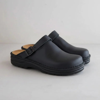 black eluxeri clogs from the front and side