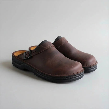 brown eluxeri clogs from the front on a light background