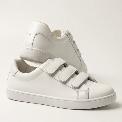 White eluxeri easewalks with velcro straps on a light gray background
