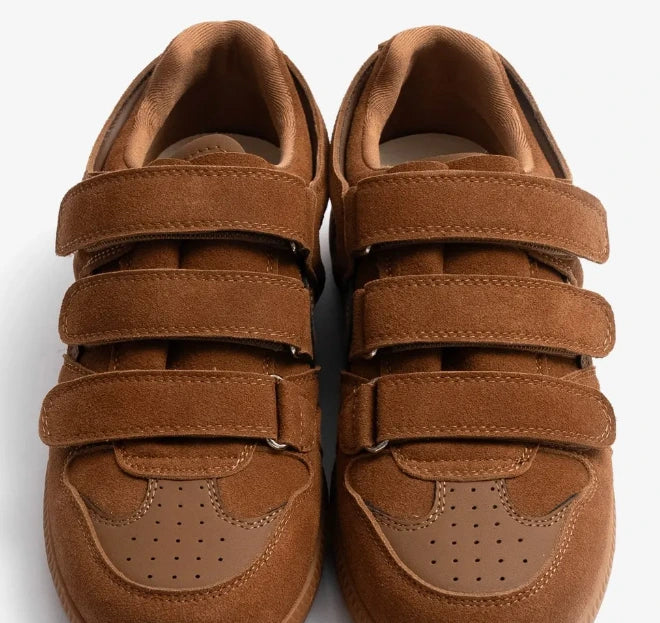 Pair of apricot eluxeri easewalks for women with velcro straps on a white background